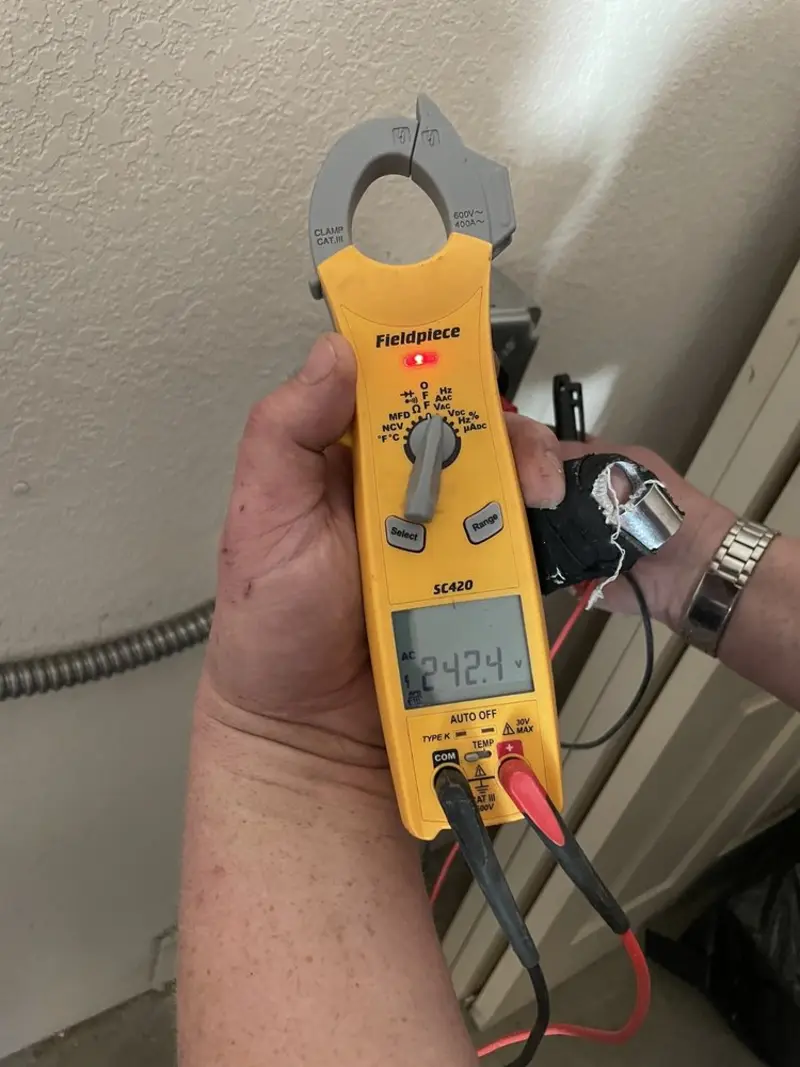 Voltage testing with clamp meter during Ceiling Fan Installation in Healdsburg